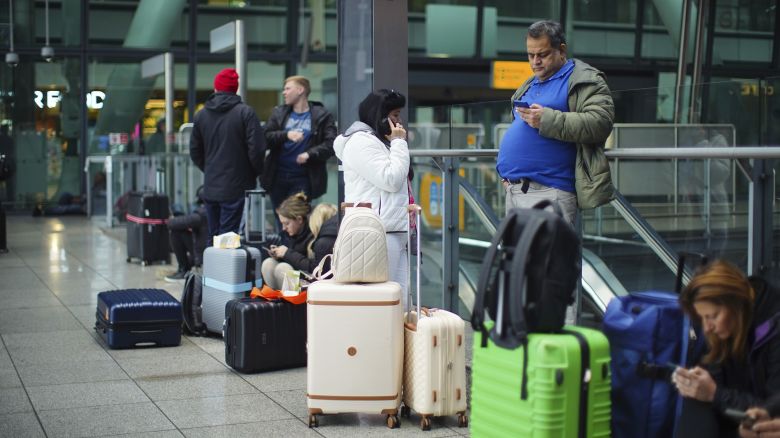 Stranded passengers at Heathrow Terminal 5 in London. More than 1,300 flights to and from Heathrow Airport will be disrupted on Friday due to the closure of the airport following a fire at the North Hyde electrical substation last night. Picture date: Friday March 21, 2025. 79470099 (Press Association via AP Images)
