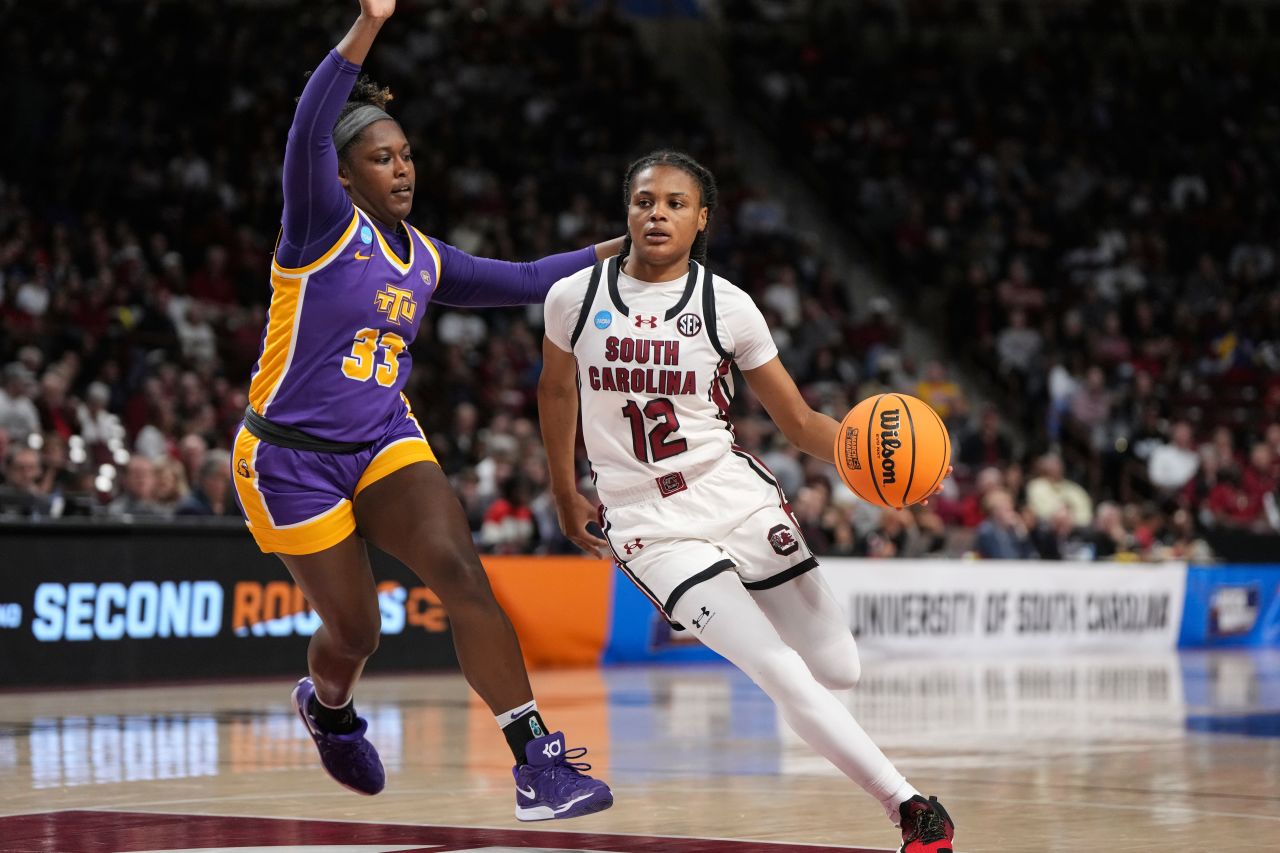 South Carolina guard MiLaysia Fulwiley drives the ball around Tennessee Tech guard Reghan Grimes.