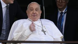 Pope Francis thumbs up as he appears at a window of the Agostino Gemelli Polyclinic in Rome, Sunday, March 23, 2025, where he has been treated for bronchitis and bilateral pneumonia since Feb. 14. (AP Photo/Domenico Stinellis)