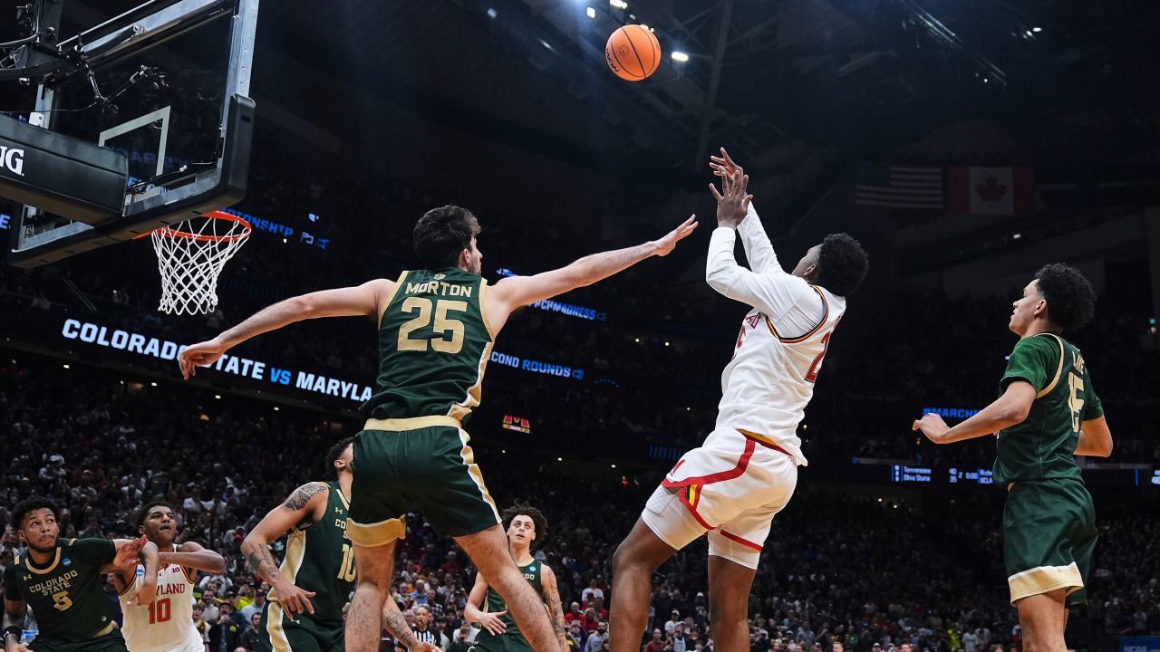 Maryland center Derik Queen, center, makes the game-winning basket against Colorado State guard Ethan Morton (25) and guard Jalen Lake, right, in the final seconds of the game in the second round of the NCAA college basketball tournament Sunday, March 23, 2025, in Seattle. (AP Photo/Lindsey Wasson)