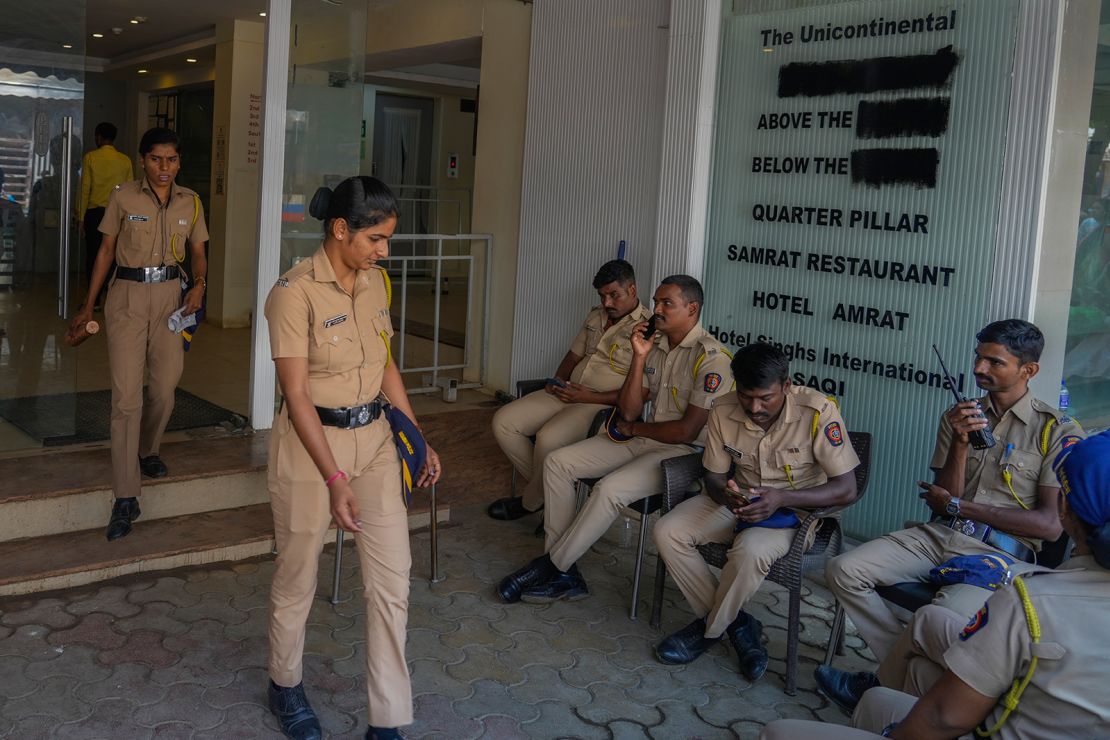 Police gather outside the venue which was vandalized after Indian comedian Kunal Kamra made a joke referring to Shiv Sena politician Eknath Shinde, in Mumbai on March 24, 2025.