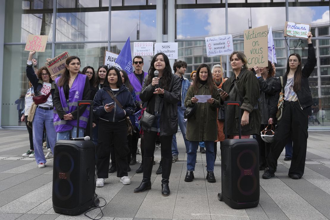 Women demonstrate outside the court where actor Gerard Depardieu faces trial for the alleged sexual assaults of two women on a film set in 2021.