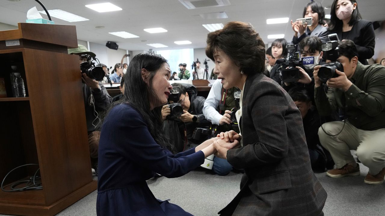 Truth and Reconciliation Commission Chairperson Park Sun Young, right, comforts adoptee Yooree Kim during a press conference in Seoul, South Korea, on Wednesday, March 26, 2025.