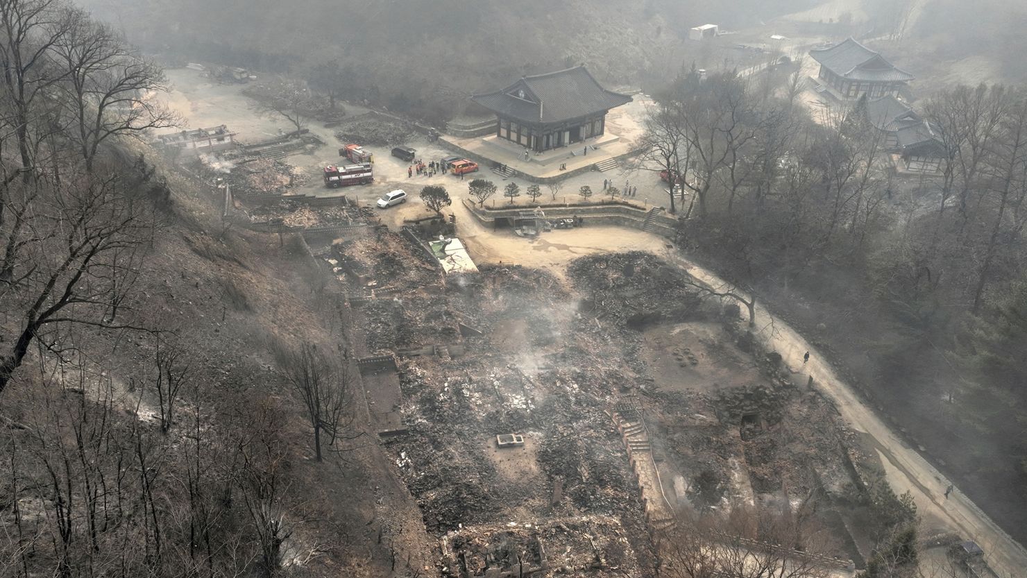 The remains of burnt-out pavilions due to wildfires are seen at the Gounsa temple in Uiseong, South Korea, Wednesday, March 26, 2025. (Kim Do-hoon/Yonhap via AP)