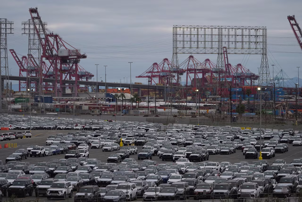 New Toyota vehicles are stored at an imports processing facility at the Port of Long Beach in Long Beach, California, on Wednesday.