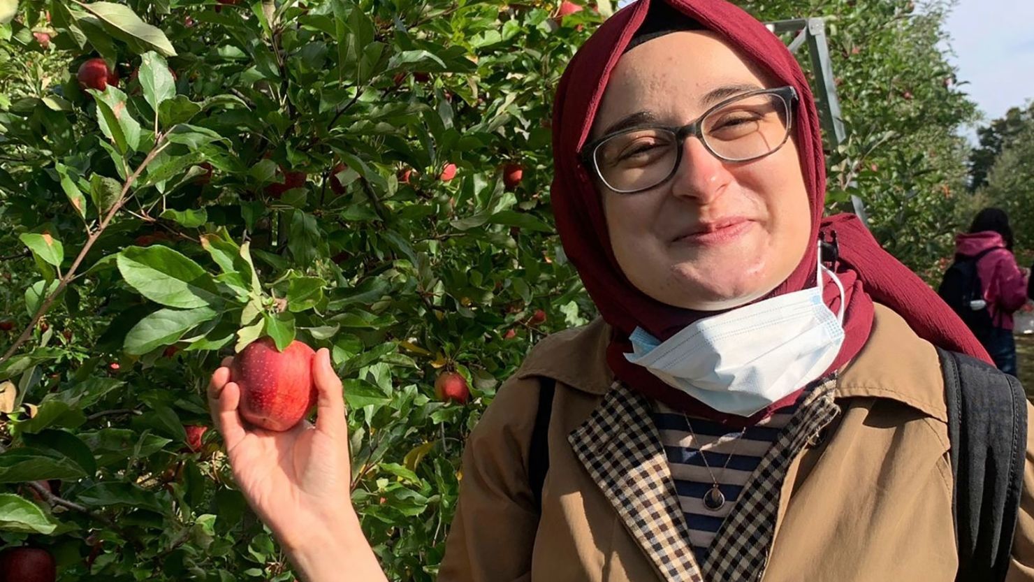 This photo shared with The Associated Press shows Rümeysa Öztürk on an apple-picking trip in 2021.