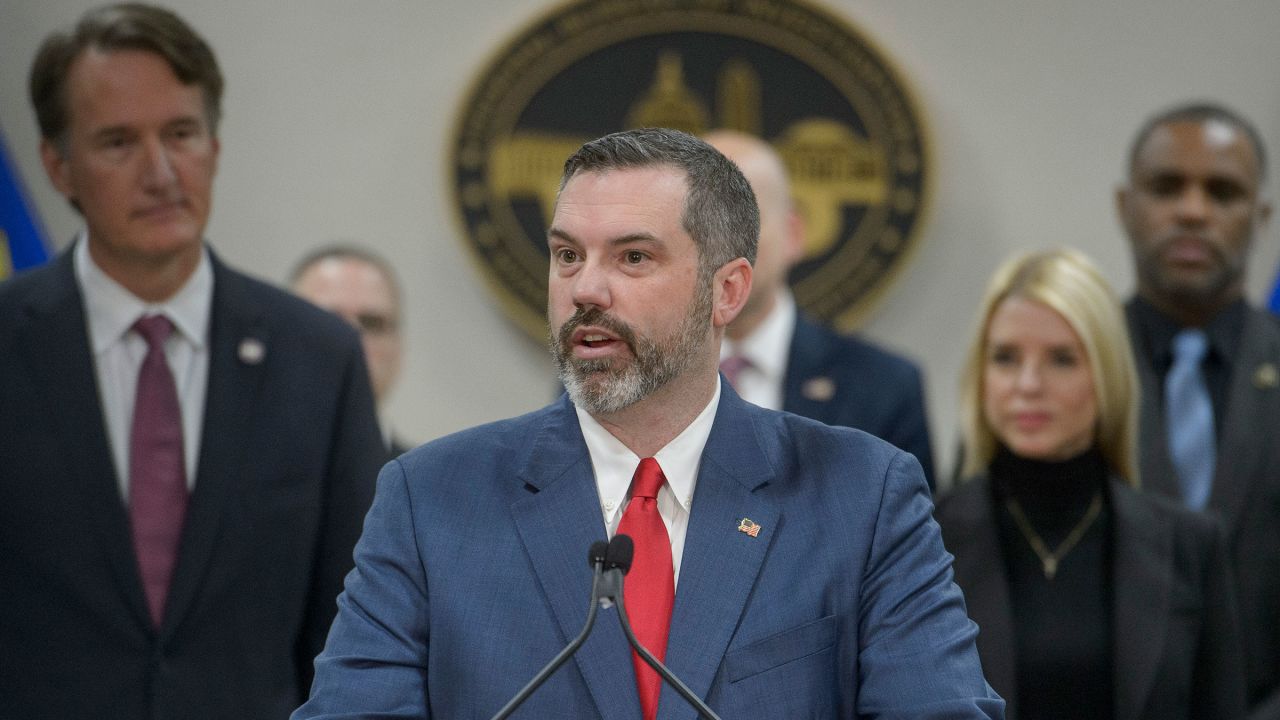 Erik Siebert, then the interim US Attorney for the eastern district of Virginia, speaks during a news conference in Manassas, Virginia, on March 27, 2025. Alongside him are Virginia Gov. Glenn Youngkin and Attorney General Pam Bondi.