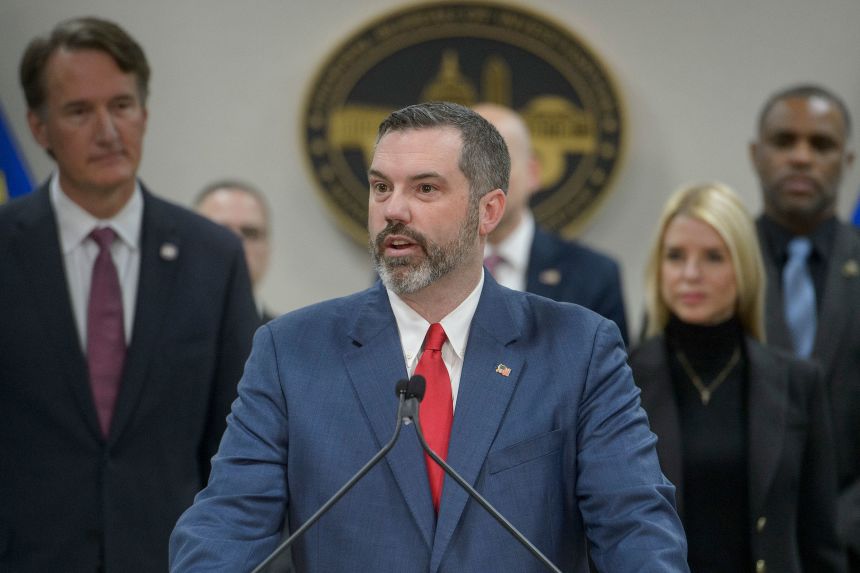 Erik Siebert, then the interim US Attorney for the eastern district of Virginia, speaks during a news conference in Manassas, Virginia, on March 27, 2025. Alongside him are Virginia Gov. Glenn Youngkin and Attorney General Pam Bondi.