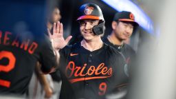 Baltimore Orioles' Tyler O'Neill (9) celebrates with teammates a after hitting three-run home run during third inning MLB baseball action against the Toronto Blue Jays, in Toronto on Thursday, March 27, 2025.