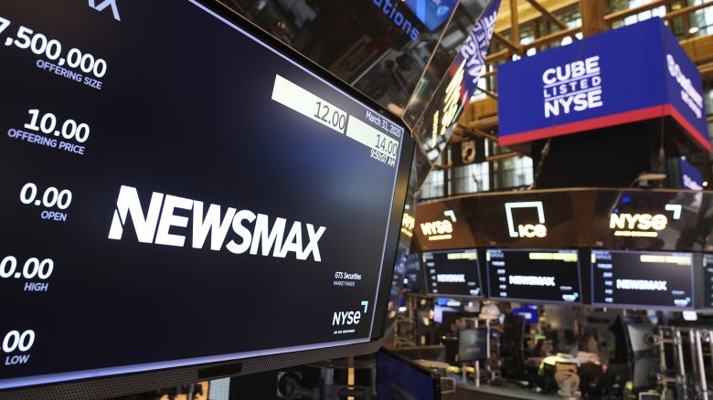 A display shows a Newsmax logo on the day of their IPO on the floor at the New York Stock Exchange.