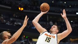 Denver Nuggets center Nikola Jokic, shoots for a basket over Minnesota Timberwolves center Rudy Gobert in the first half of an NBA basketball game in Denver, Colorado, on Tuesday, April 1, 2025.