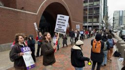 Protesters gather outside federal court during a hearing with lawyers for Rumeysa Ozturk, a Tufts University doctoral student from Turkey who was detained by immigration authorities, Thursday, April 3, 2025 in Boston. (AP Photo/Rodrique Ngowi)
