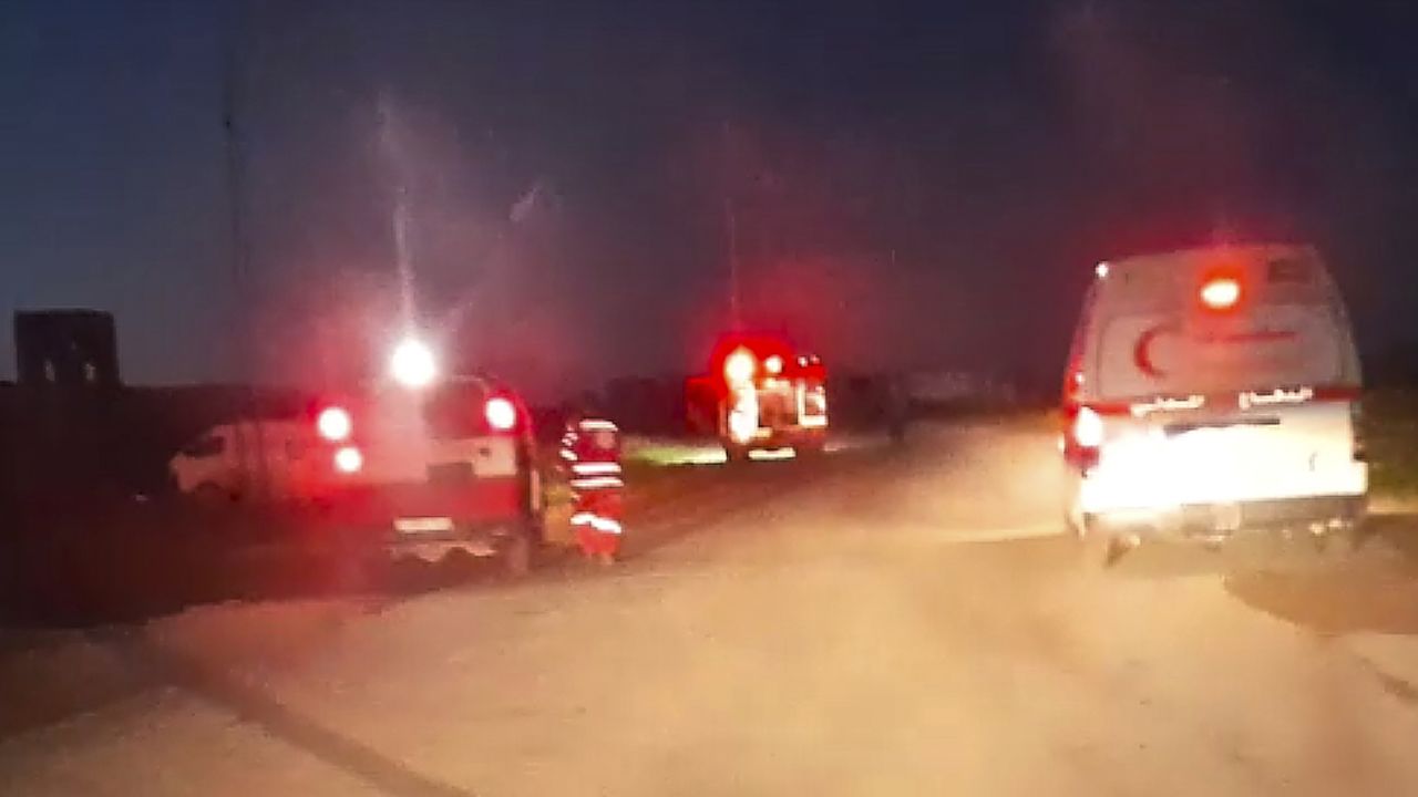 This frame grab from a video released by the Palestinian Red Crescent Society, taken with a phone by one of the 15 Palestinians medics killed, shows Red Crescent emergency vehicles, their lights and sirens flashing and their logos clearly visible, seconds before they came under a barrage of gunfire from Israeli army soldiers in Tel al-Sultan, a district of the southern Gaza Strip town of Rafah, early Sunday, March 23, 2025. (Palestinian Red Crescent Society via AP)