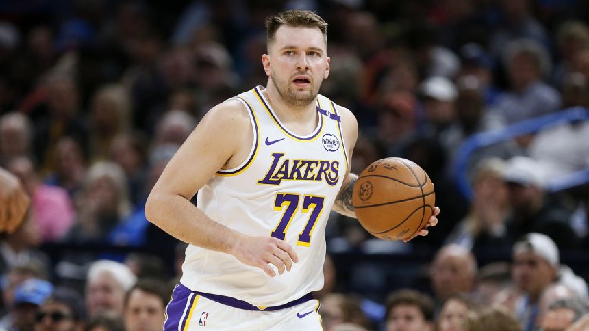 Los Angeles Lakers guard Luka Doncic handles the ball during the first half of an NBA basketball game against the Oklahoma City Thunder, Sunday, April 6, 2025, in Oklahoma City. (AP Photo/Nate Billings)