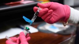 Anna Hicks prepares a measles, mumps and rubella vaccine at the Andrews County Health Department, Tuesday, April 8, 2025, in Andrews, Texas. (AP Photo/Annie Rice)