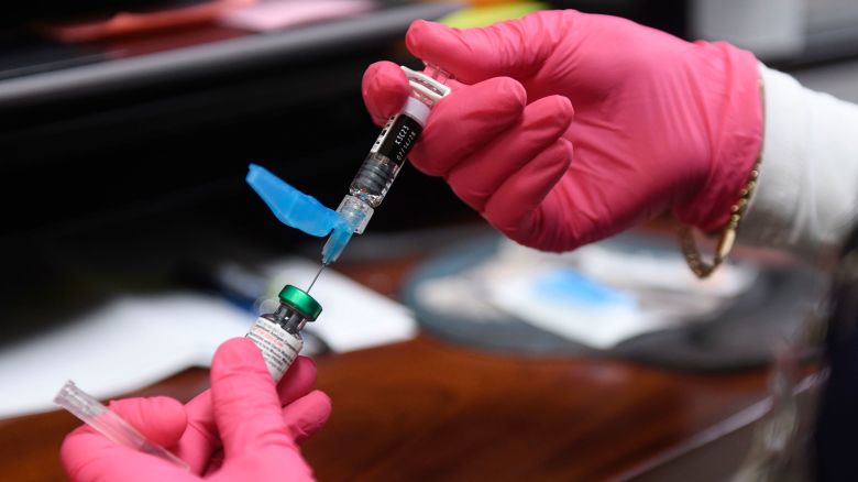 A measles, mumps and rubella vaccine is prepared at the Andrews County Health Department in Andrews, Texas, on April 8.