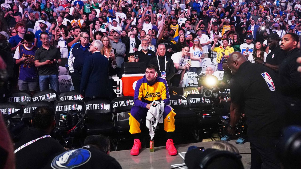 Los Angeles Lakers' Luka Dončić watches a tribute video before playing in his first game in Dallas since being traded.