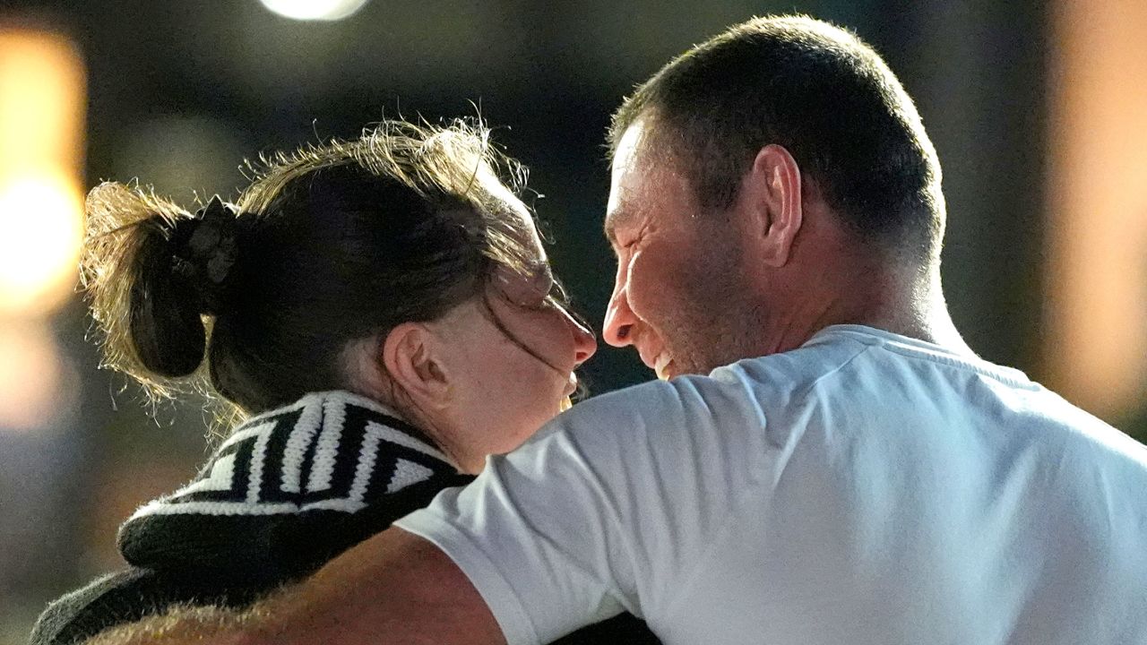 Ksenia Karelina walks with her fiancé, professional boxer Chris van Heerden, as she arrives Thursday, April 10, 2025, at Joint Base Andrews, Md. (AP Photo/Alex Brandon)