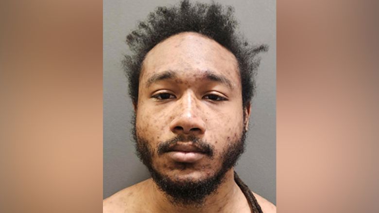 The booking photo of Kathan Guzman.