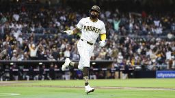 San Diego Padres' Jason Heyward points towards his dugout while running the bases after hitting a solo home run against the Colorado Rockies in the first inning of a baseball game Saturday, April 12, 2025, in San Diego. (AP Photo/Derrick Tuskan)