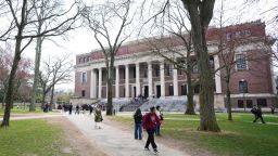 Pedestrians walk past the Widener Library at Harvard University, Tuesday, April 15, 2025, in Cambridge, Mass. (AP Photo/Charles Krupa)