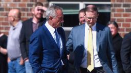 Health and Human Services Secretary Robert F. Kennedy Jr., left, stands with Dr. Ben Edwards, right, outside the Reinlander Mennonite Church in Seminole, Texas, on Sunday, April 6, 2025, after a second measles death. (AP Photo/Annie Rice, File)