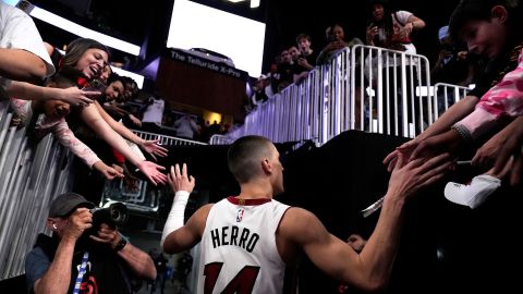Miami Heat guard Tyler Herro greets fans as he leaves the court after beating the Atlanta Hawks in Atlanta on Friday. Herro scored 30 points in the Heat's overtime victory, which secured their spot in the playoffs.