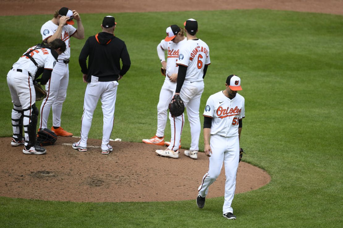 Baltimore Orioles starting pitcher Charlie Morton walks back to the dugout after he was pulled during the third inning of a baseball game against the Cincinnati Reds.