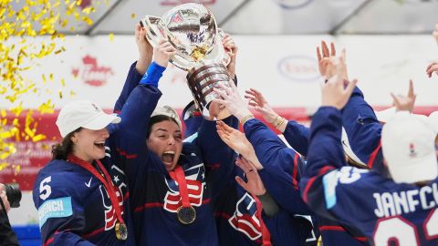 United states players celebrate with a trophy after the gold medal match between Canada and United States at the Women's Ice Hockey Championships in Ceske Budejovice, Czech Republic, on Sunday, April 20, 2025.