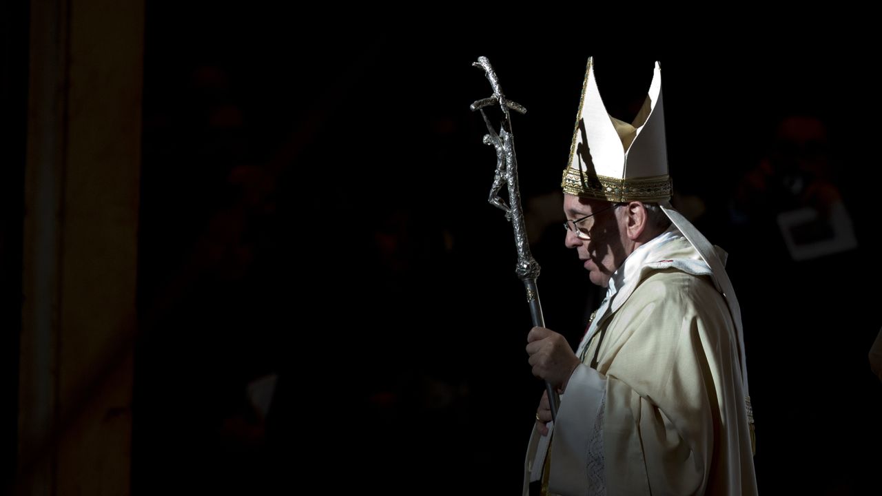 Pope Francis holds the pastoral staff as he leaves after celebrating a Mass in St. Peter's Basilica, at the Vatican, to mark Epiphany, Monday, Jan. 6, 2014.