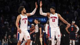 Detroit Pistons guard Cade Cunningham, left, and forward Tobias Harris high-five at the end of their Game 2 win against the New York Knicks on Monday.