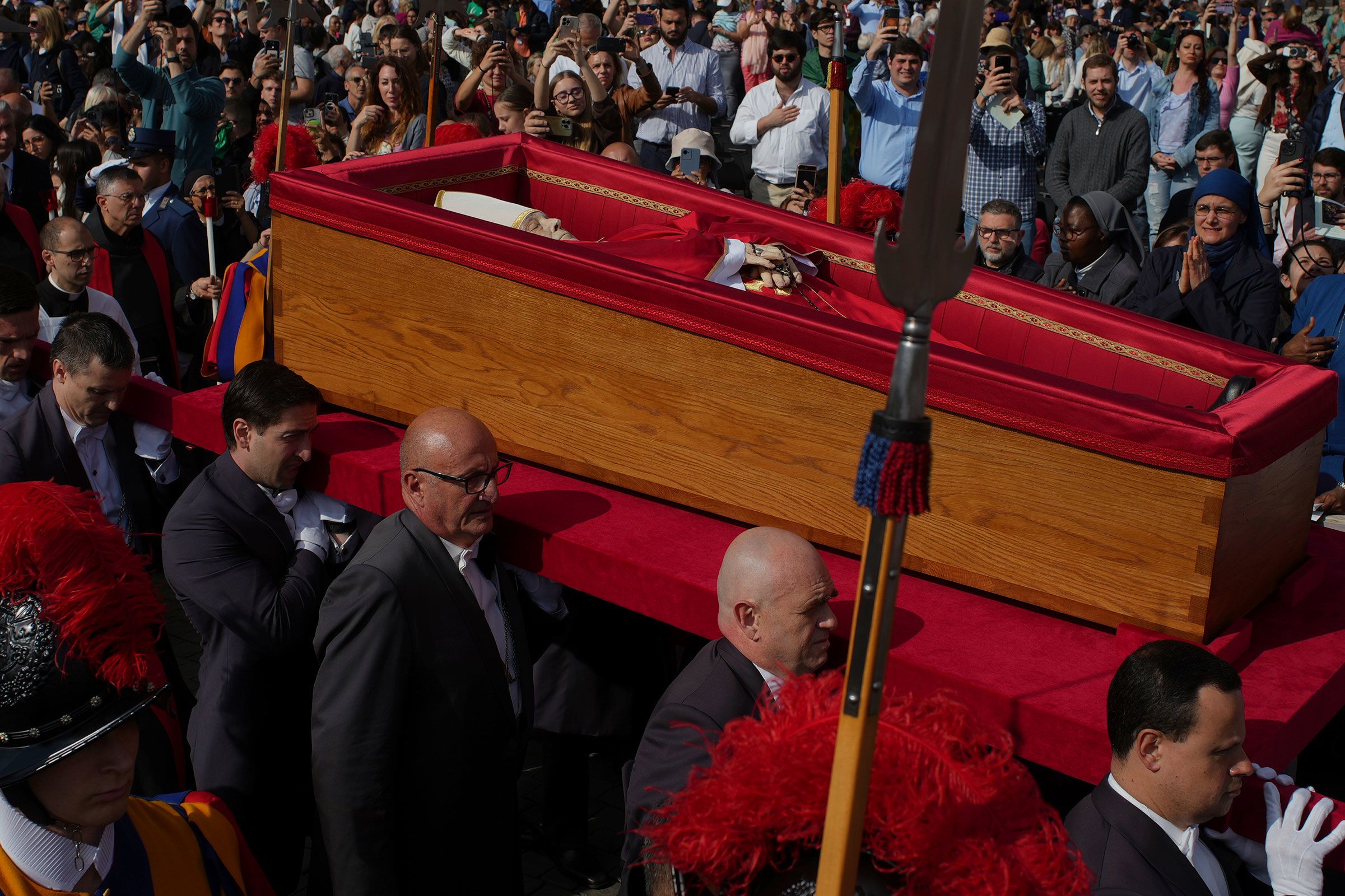 The pope's coffin is carried into St. Peter's Basilica.