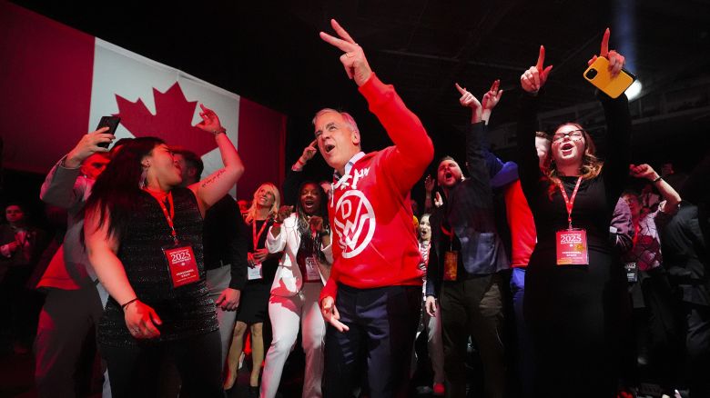 Canadian Prime Minister Mark Carney, center, dances to Canadian band Down With Webster as they play live from campaign headquarters after the Liberal Party won the Canadian election in Ottawa on Tuesday, April 29, 2025. (Sean Kilpatrick/The Canadian Press via AP)