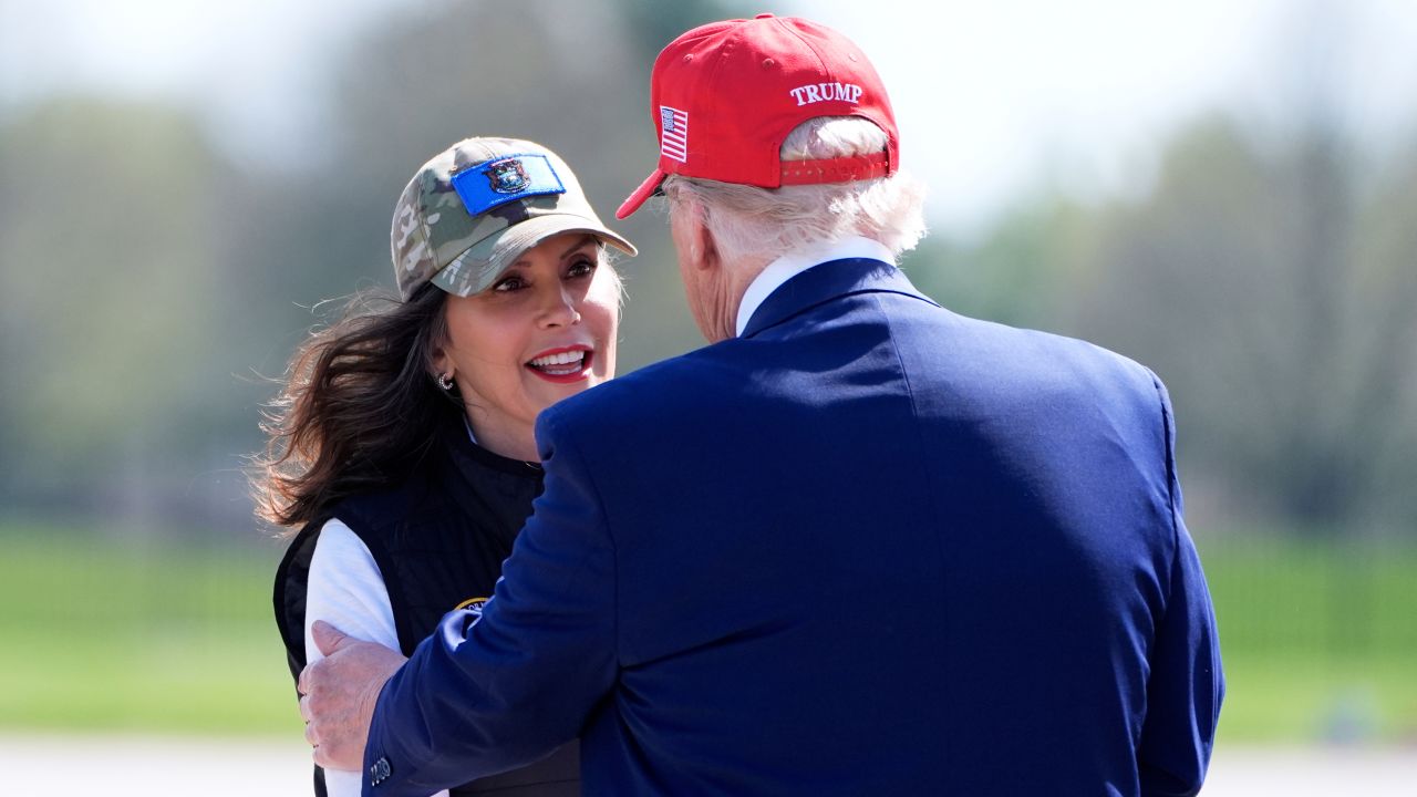 President Donald Trump greets Michigan Gov. Gretchen Whitmer as he arrives on Air Force One at Selfridge Air National Guard Base, Tuesday, April 29, 2025, in Harrison Township, Mich. (AP Photo/Alex Brandon)