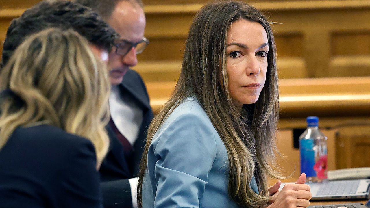Karen Read sits at the defense table during her murder trial Wednesday in Norfolk Superior Court in Dedham, Massachusetts.