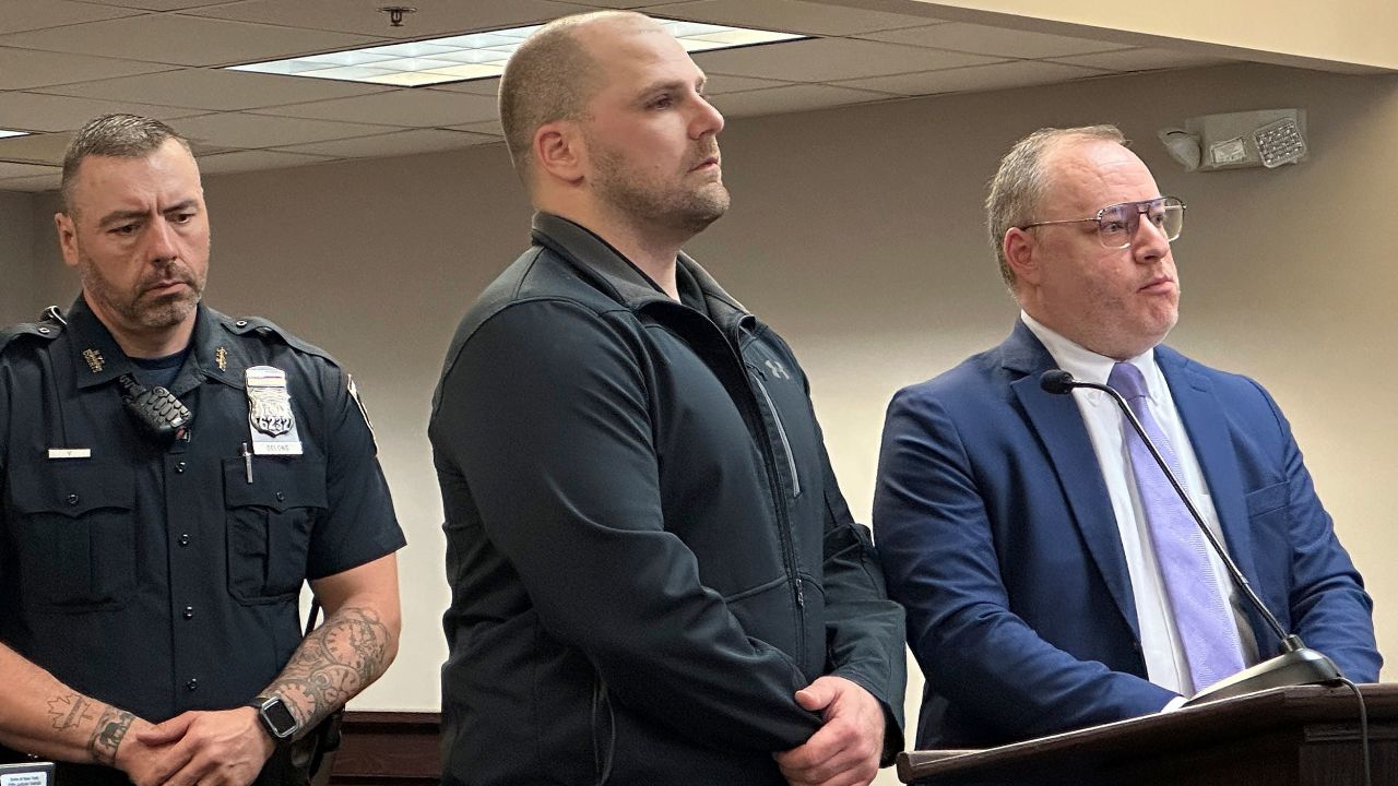 Correctional officer Christopher Walrath, center, appears in Oneida County Court, Monday, May 5, 2025, in Utica, N.Y., to enter a guilty plea for manslaughter in the December 2024 death of inmate Robert Brooks. (AP Photo/Michael Hill)