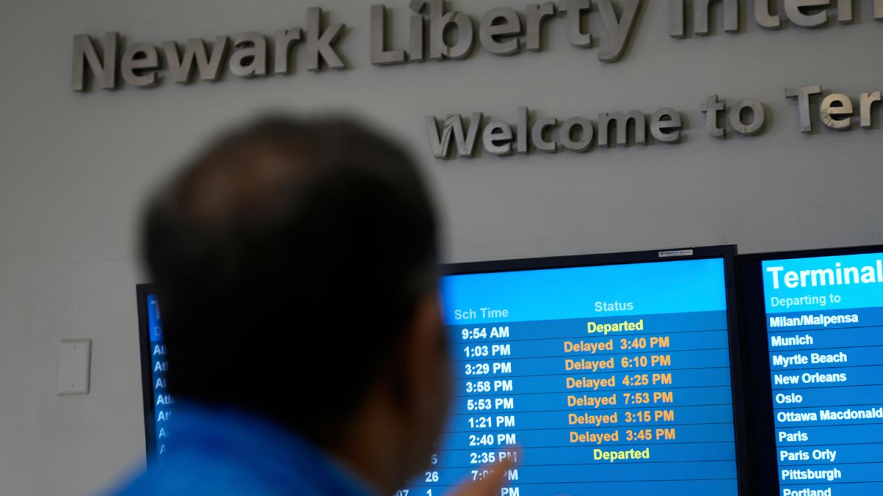 A display shows the status of flights at Newark Liberty International Airport in Newark, N.J., on Monday, May 5, 2025.