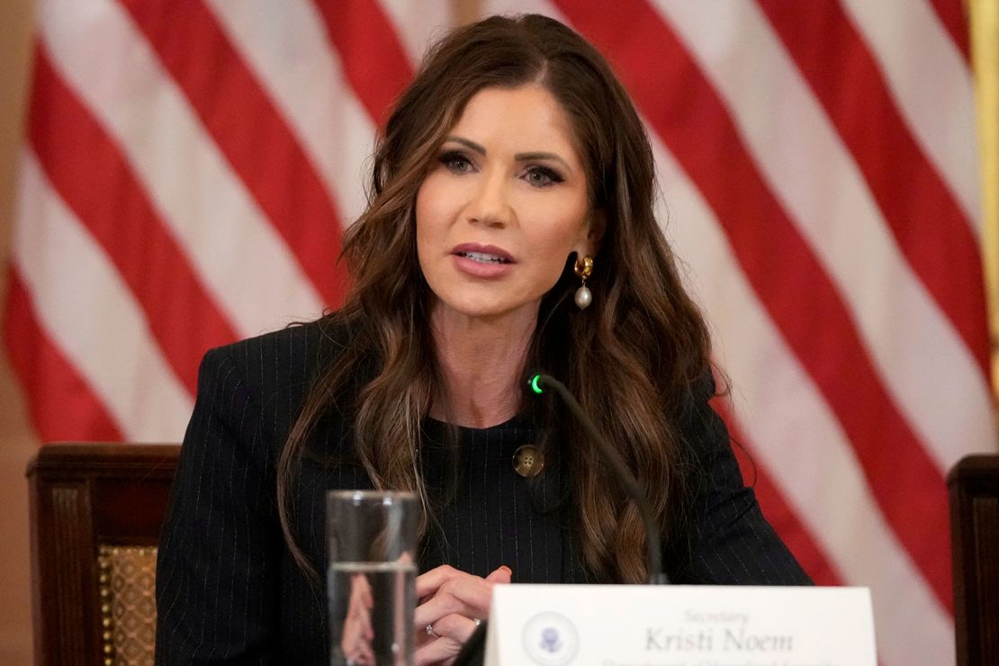 Homeland Security Secretary Kristi Noem listens as President Trump speaks during a FIFA task force meeting on the 2026 FIFA World Cup.