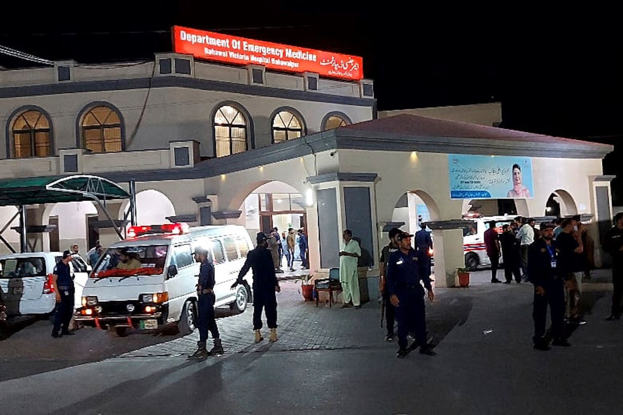 Security officials stand guard as an ambulance arrives with people injured by a suspected Indian missile attack, at a hospital in Bahawalpur, Pakistan, on Wednesday, May 7.