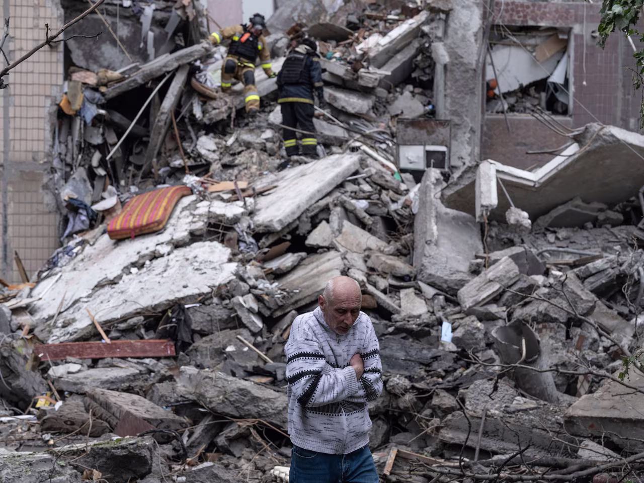 A man waits for news about his missing wife after a residential building in Kostiantynivka, Ukraine was destroyed by a Russian strike, in May.