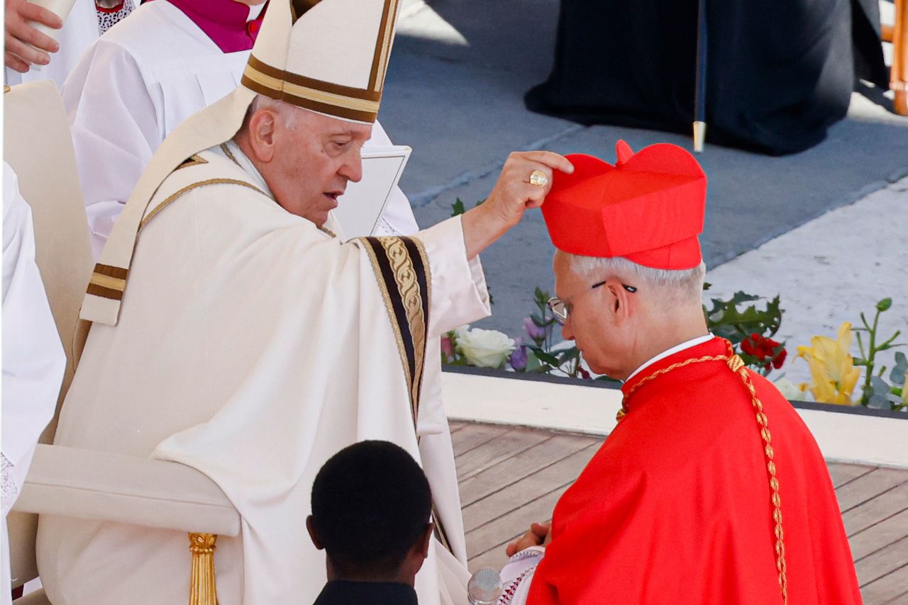 Cardinal Robert Francis Prevost, Prefect of the Dicastery for Bishops, right, receives his biretta from Pope Francis as he is elevated in St. Peter's Square at The Vatican on September 30, 2023.