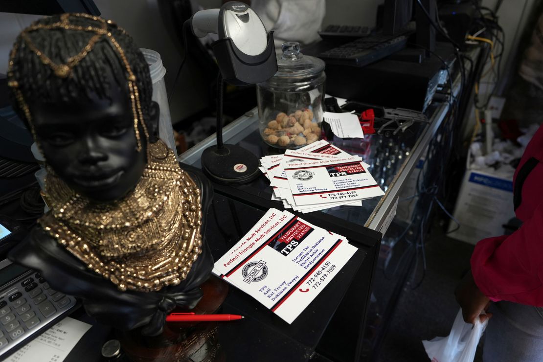 Cards with information about Temporary Protected Status are displayed at Milokan Botanica, a religious supply shop in Springfield, Ohio, on January 25, 2025.