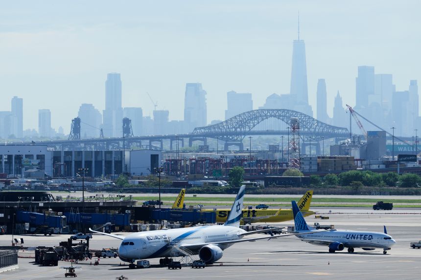 The New York City skyline is seen behind Newar Liberty International Airport in Newark, New Jersey.