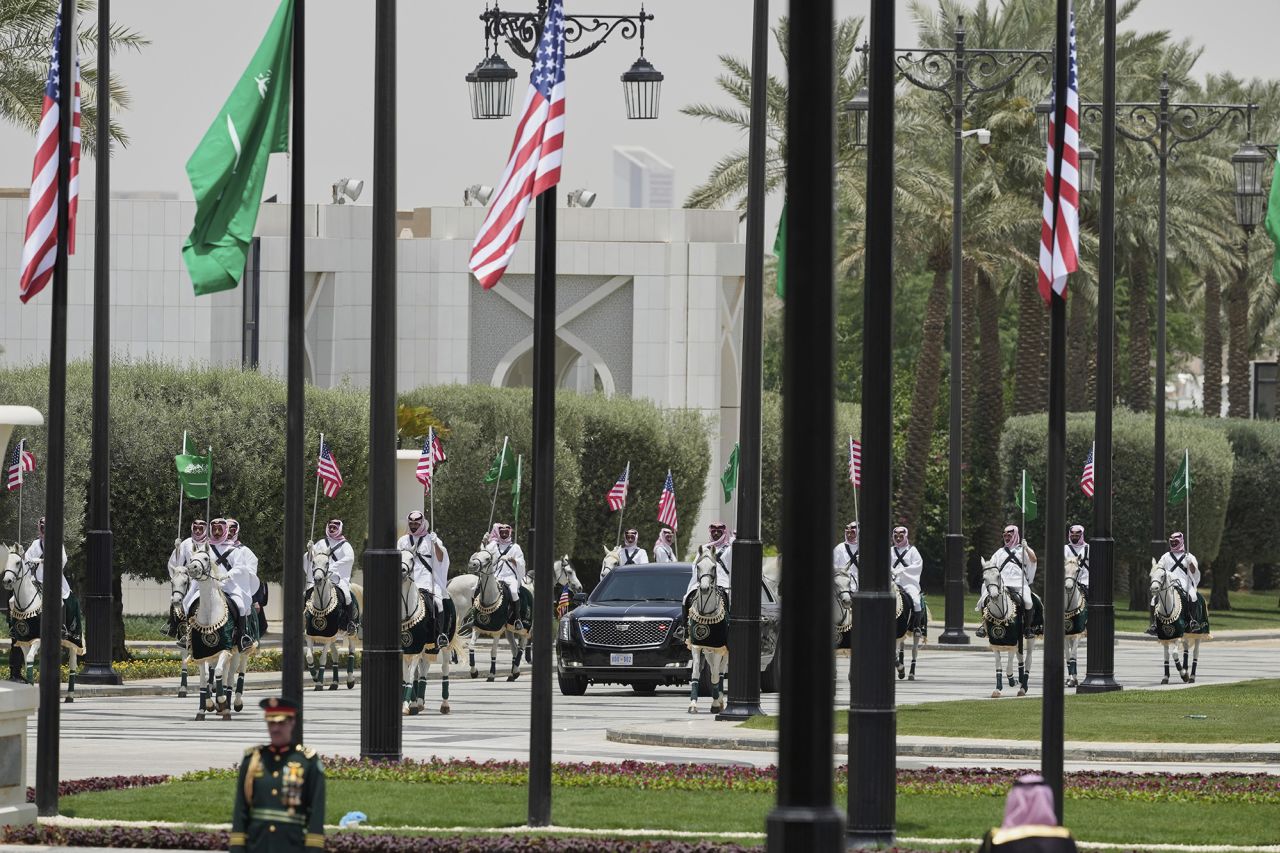 Members of a traditional Saudi honor guard escort the car carrying U.S. President Donald Trump during a welcome ceremony at the Royal Palace in Riyadh, Saudi Arabia, on Tuesday.