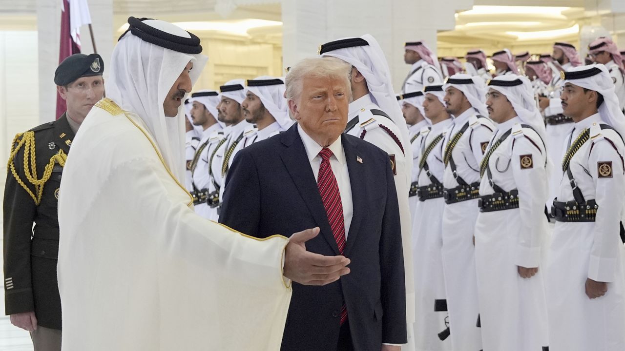 Qatar's Emir Sheikh Tamim bin Hamad Al Thani welcomes President Donald Trump during an official welcoming ceremony at the Amiri Diwan in Doha, Qatar, Wednesday, May 14, 2025. (AP Photo/Alex Brandon)