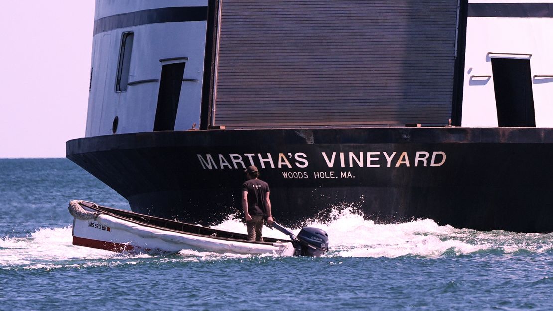 A man navigates the wake behind the Martha's Vineyard Ferry, Monday, May 12, 2025, in Vineyard Haven, Mass.