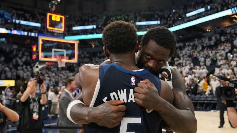 Minnesota Timberwolves forward Julius Randle and guard Anthony Edwards hug after Game 5 of an NBA basketball second-round playoff series against the Golden State Warriors, in Minneapolis on Thursday, May 15, 2025.