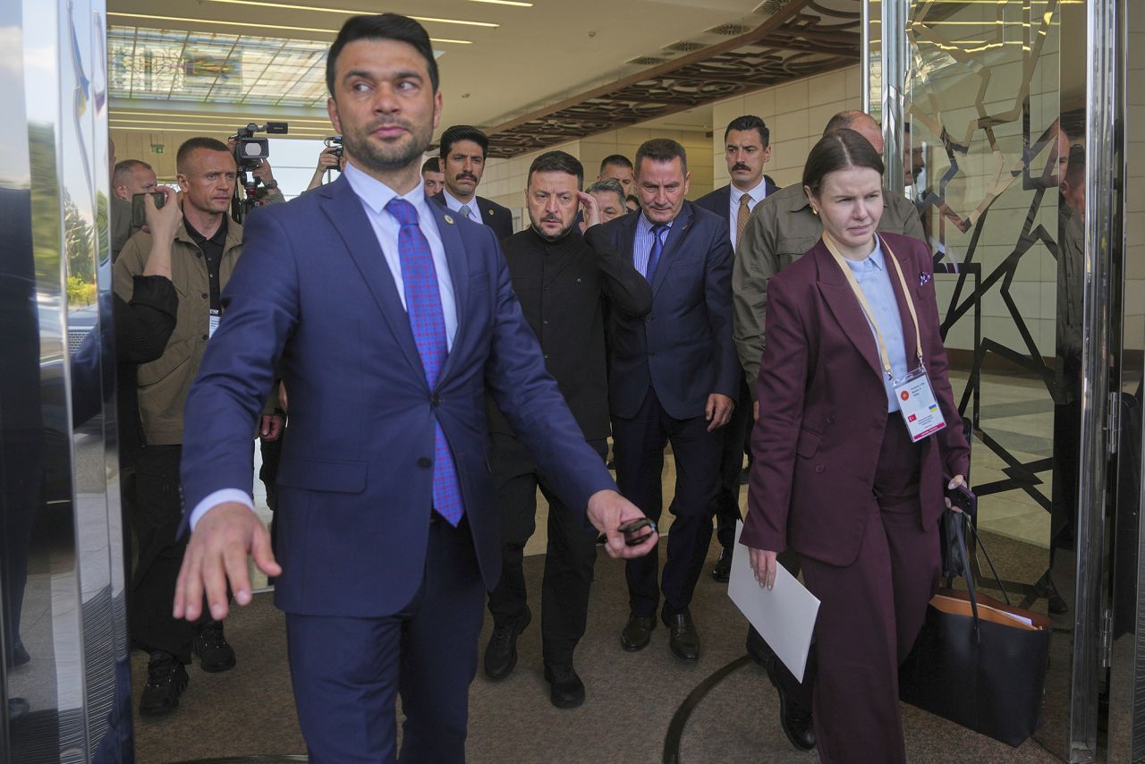 Ukrainian President Volodymyr Zelensky, center, arrives at Esenboga airport in Ankara, Turkey, on Thursday.