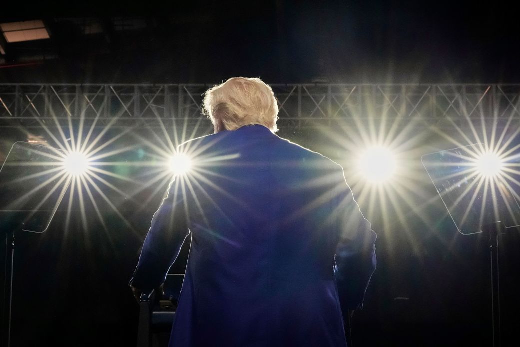 President Donald Trump speaks on stage at the Al Udeid Air Base, in Doha, Qatar, on May 15.