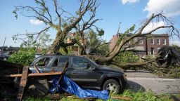 A large tree blocks a road after a severe storm moved through Friday, May 16, 2025, in St. Louis. (AP Photo/Jeff Roberson)